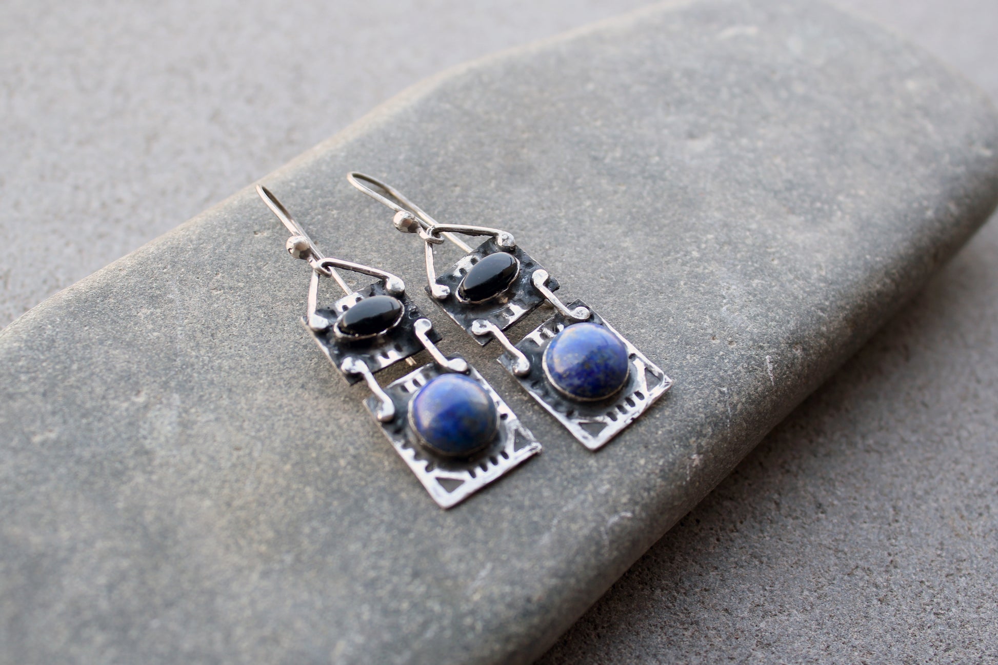 Handmade Armenian artisan silversmith sterling silver rectangular drop drop earrings with round lapis lazuli and oval black onyx cabochons, featuring ethnic-inspired textured metalwork 