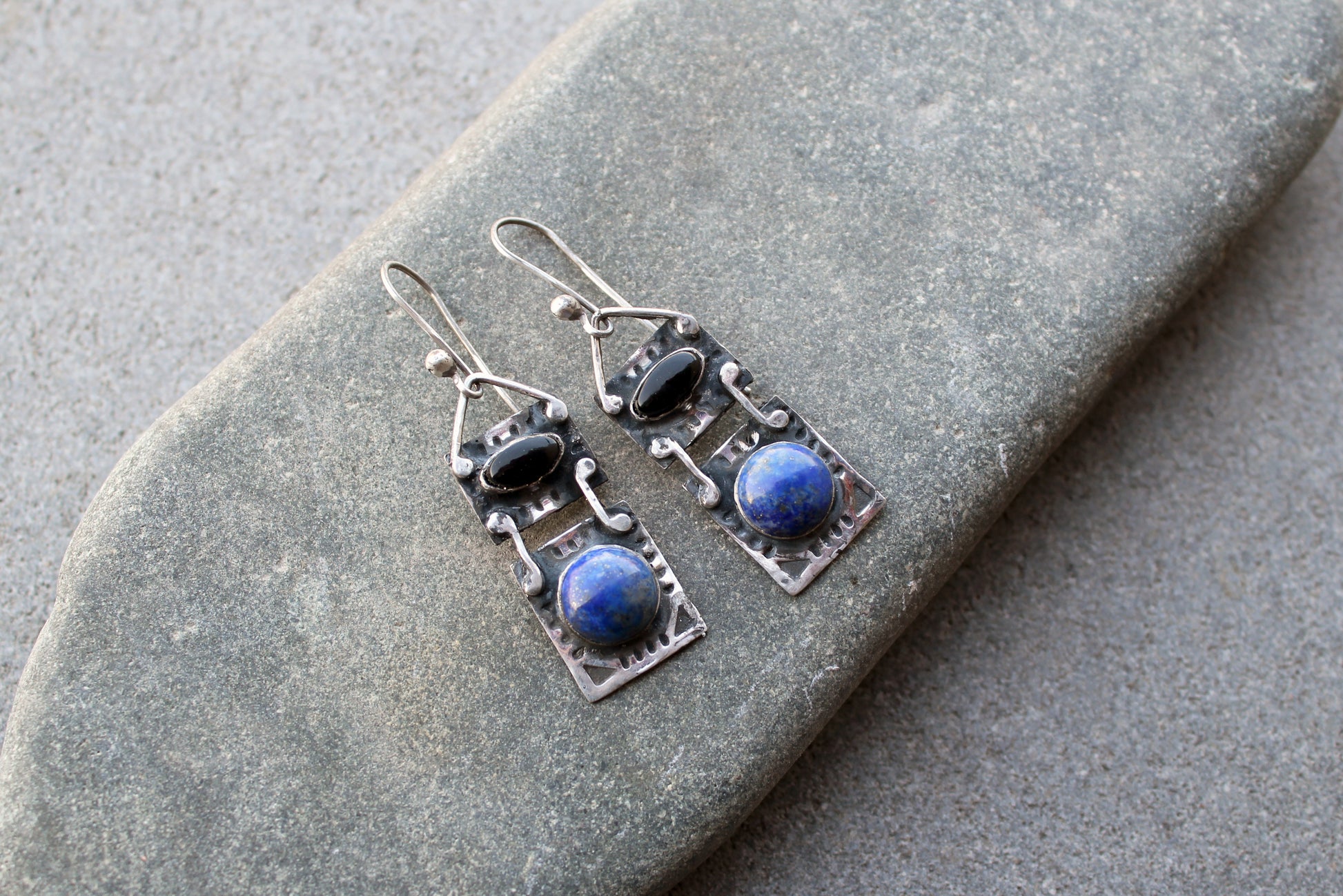 Handmade Armenian artisan silversmith sterling silver rectangular drop drop earrings with round lapis lazuli and oval black onyx cabochons, featuring ethnic-inspired textured metalwork 