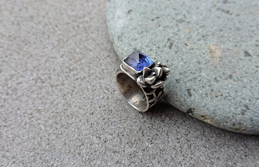 Artisan Armenian handmade sterling silver ring with rectangular lab-grown blue corundum gemstone, accented with organic twig textures and hand cast succulent details