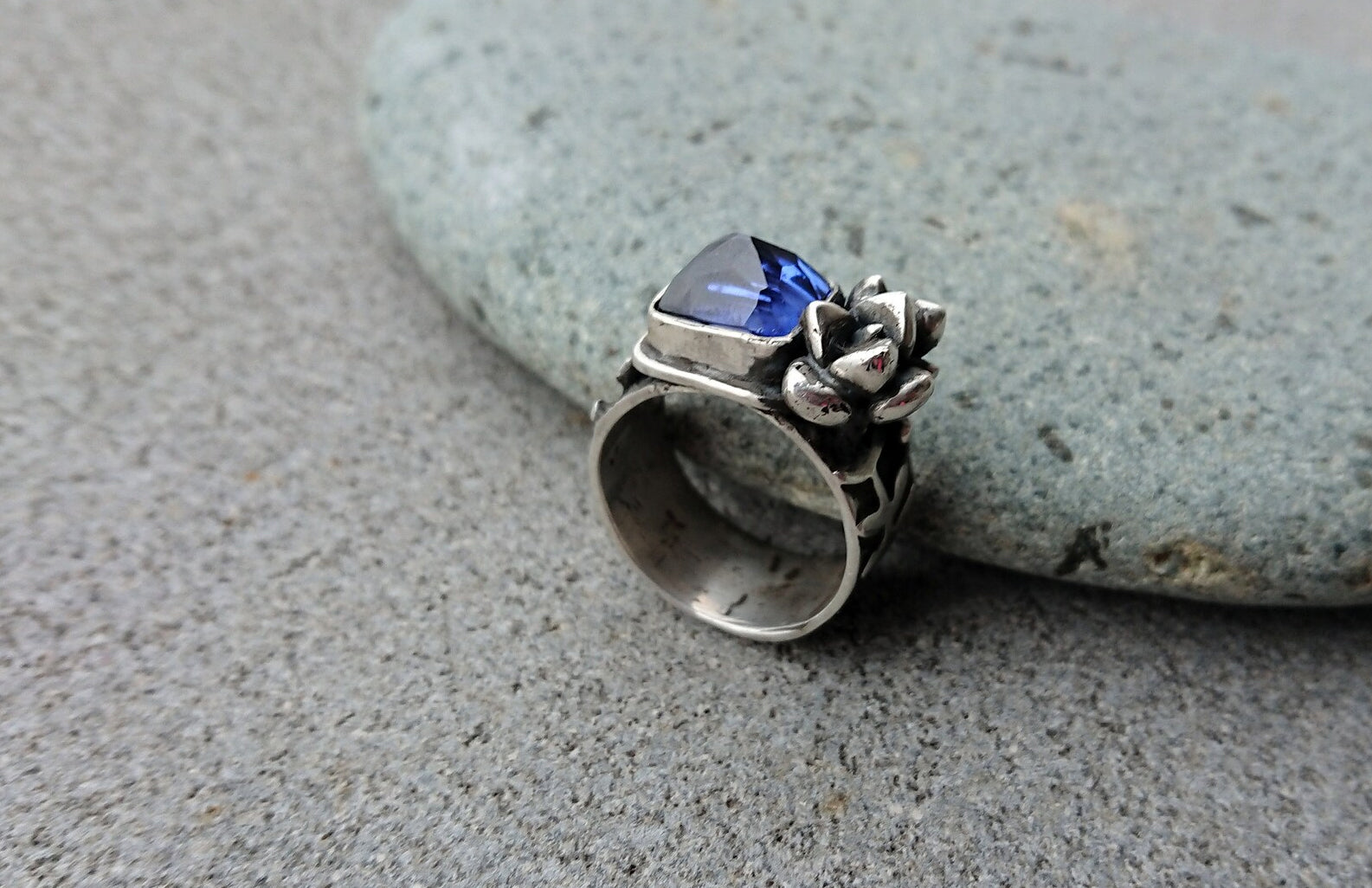 Artisan Armenian handmade sterling silver ring with rectangular lab-grown blue corundum gemstone, accented with organic twig textures and hand cast succulent details