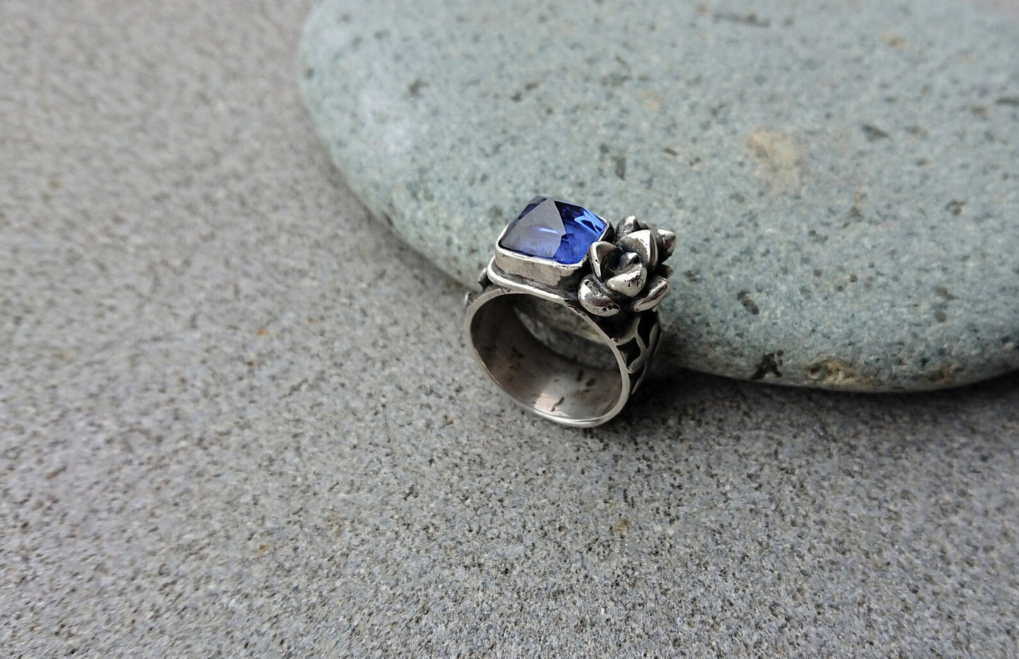 Artisan Armenian handmade sterling silver ring with rectangular lab-grown blue corundum gemstone, accented with organic twig textures and hand cast succulent details