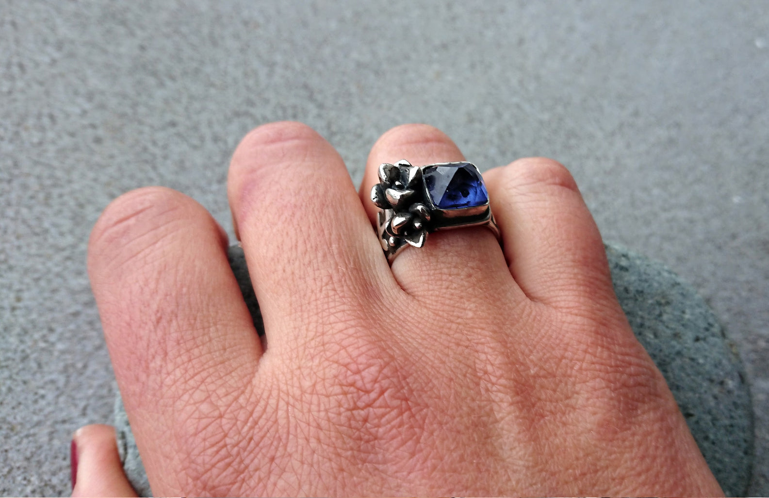 Artisan Armenian handmade sterling silver ring with rectangular lab-grown blue corundum gemstone, accented with organic twig textures and hand cast succulent details