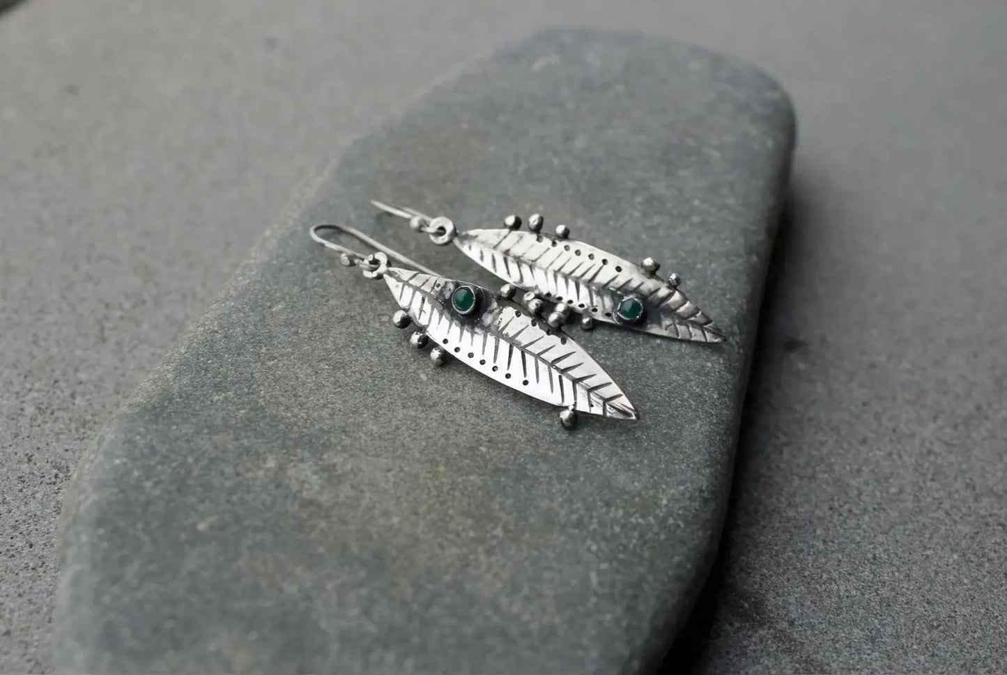 Handmade Armenian sterling silver leaf earrings featuring small round green onyx gemstones, oxidized finish with granule detailing