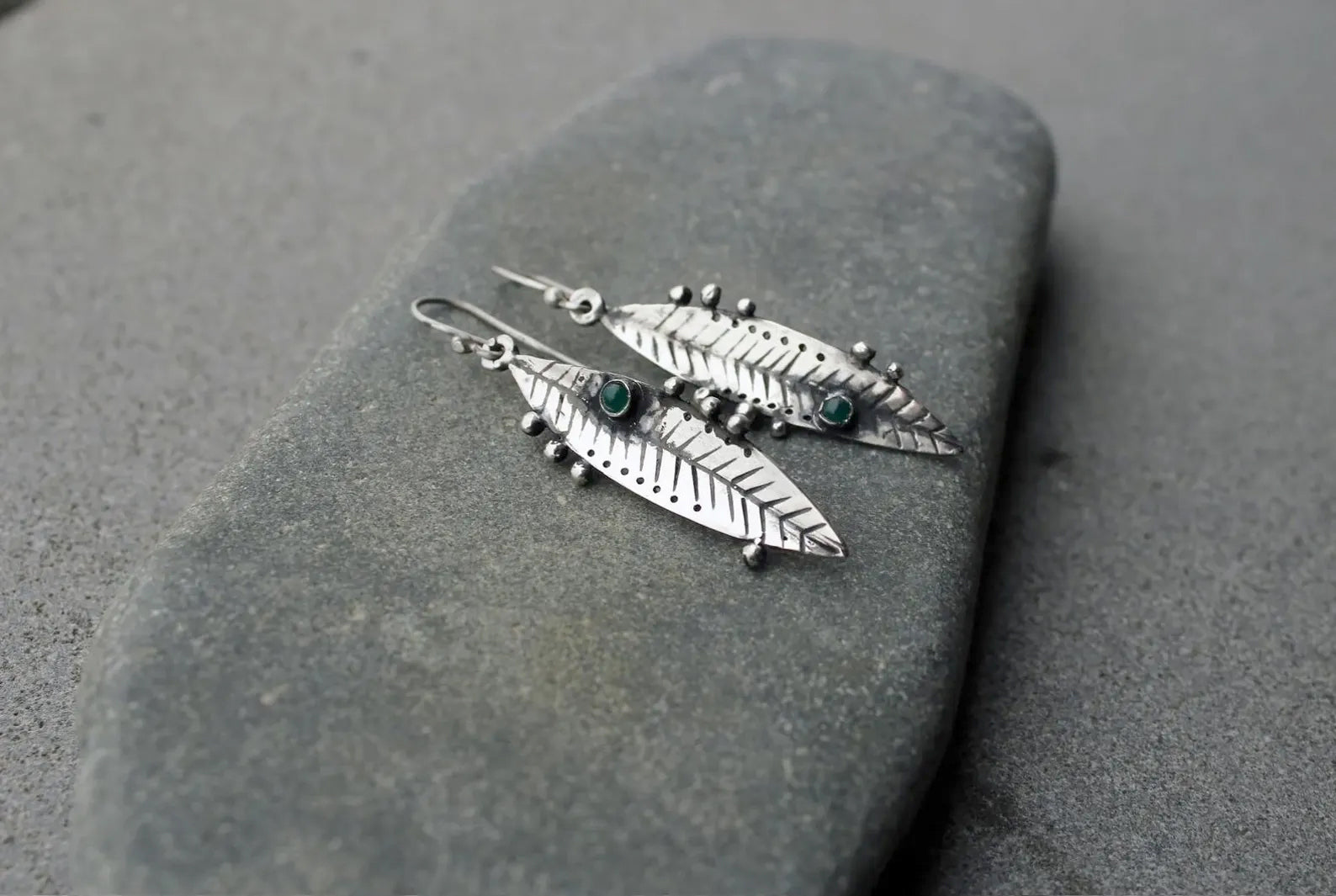 Handmade Armenian sterling silver leaf earrings featuring small round green onyx gemstones, oxidized finish with granule detailing