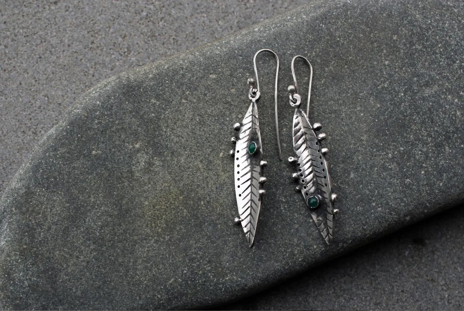 Handmade Armenian sterling silver leaf earrings featuring small round green onyx gemstones, oxidized finish with granule detailing