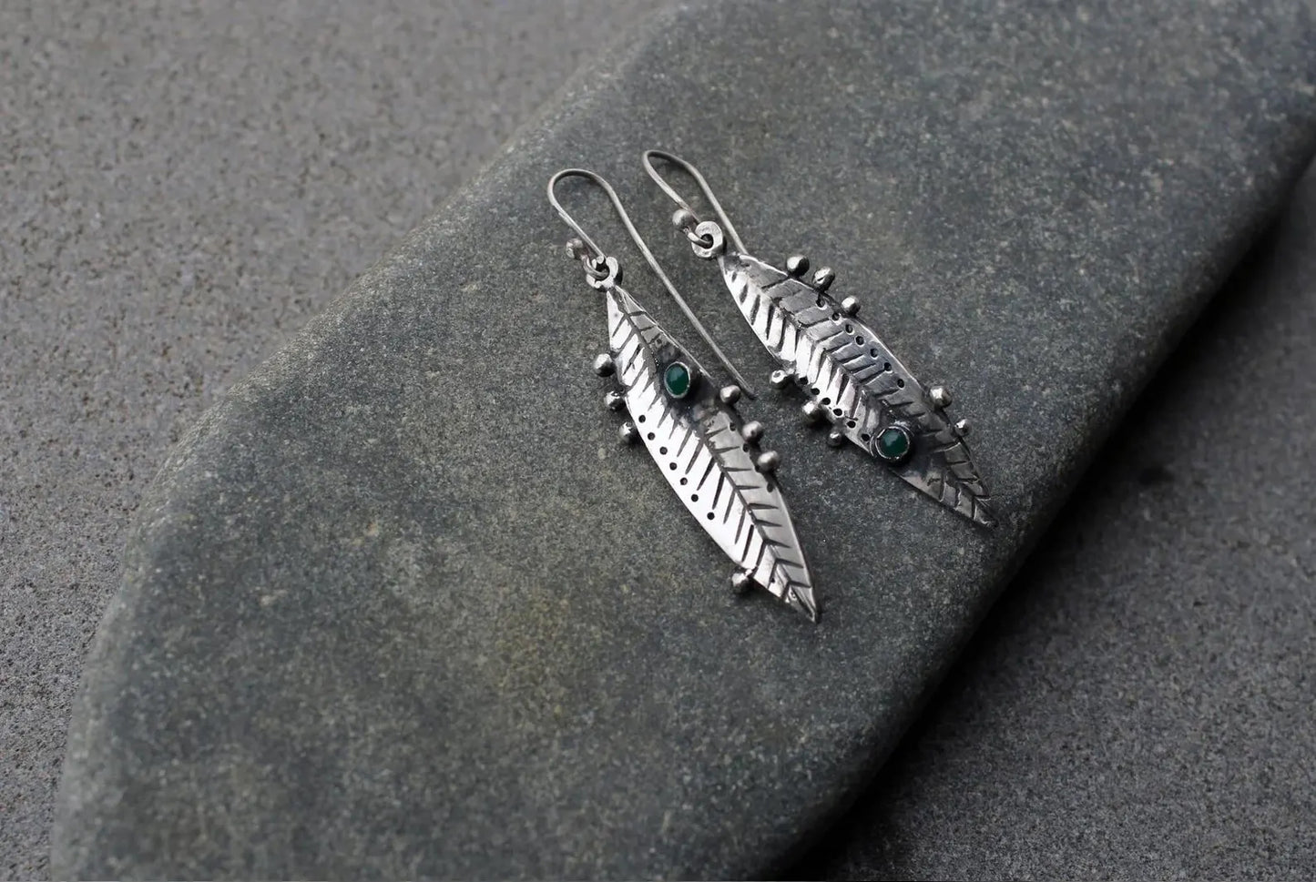 Handmade Armenian sterling silver leaf earrings featuring small round green onyx gemstones, oxidized finish with granule detailing