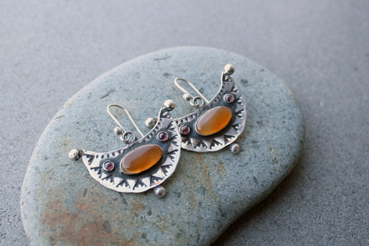 Artisan Armenian handmade silver earrings featuring oval carnelian cabochons and red garnet accents with traditional stamped detailing