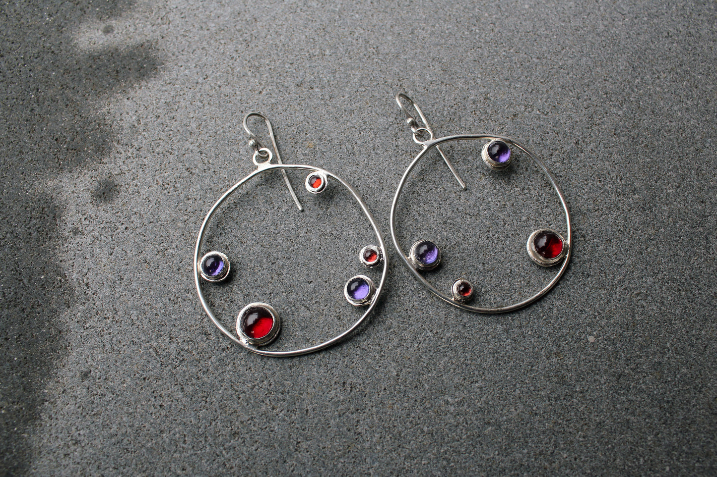 Armenian artisan handmade silver earrings with colorful stones in a minimalist big circle design