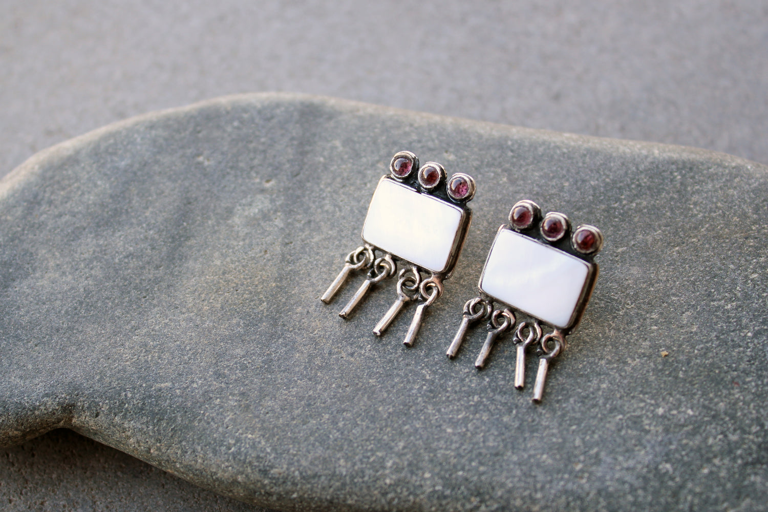 Armenian artisan handmade sterling silver stud earrings with square mother of pearl center, garnet stones and dangling fringe details