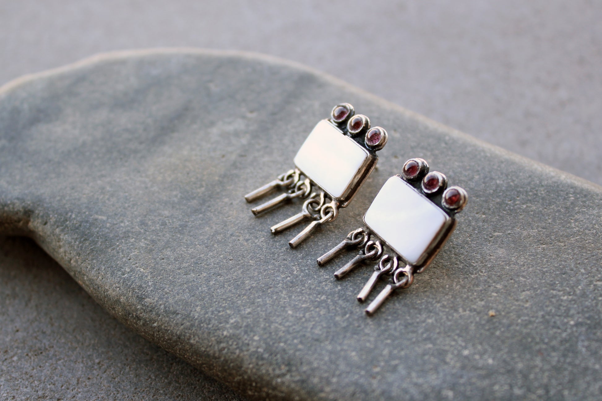 Armenian artisan handmade sterling silver stud earrings with square mother of pearl center, garnet stones and dangling fringe details