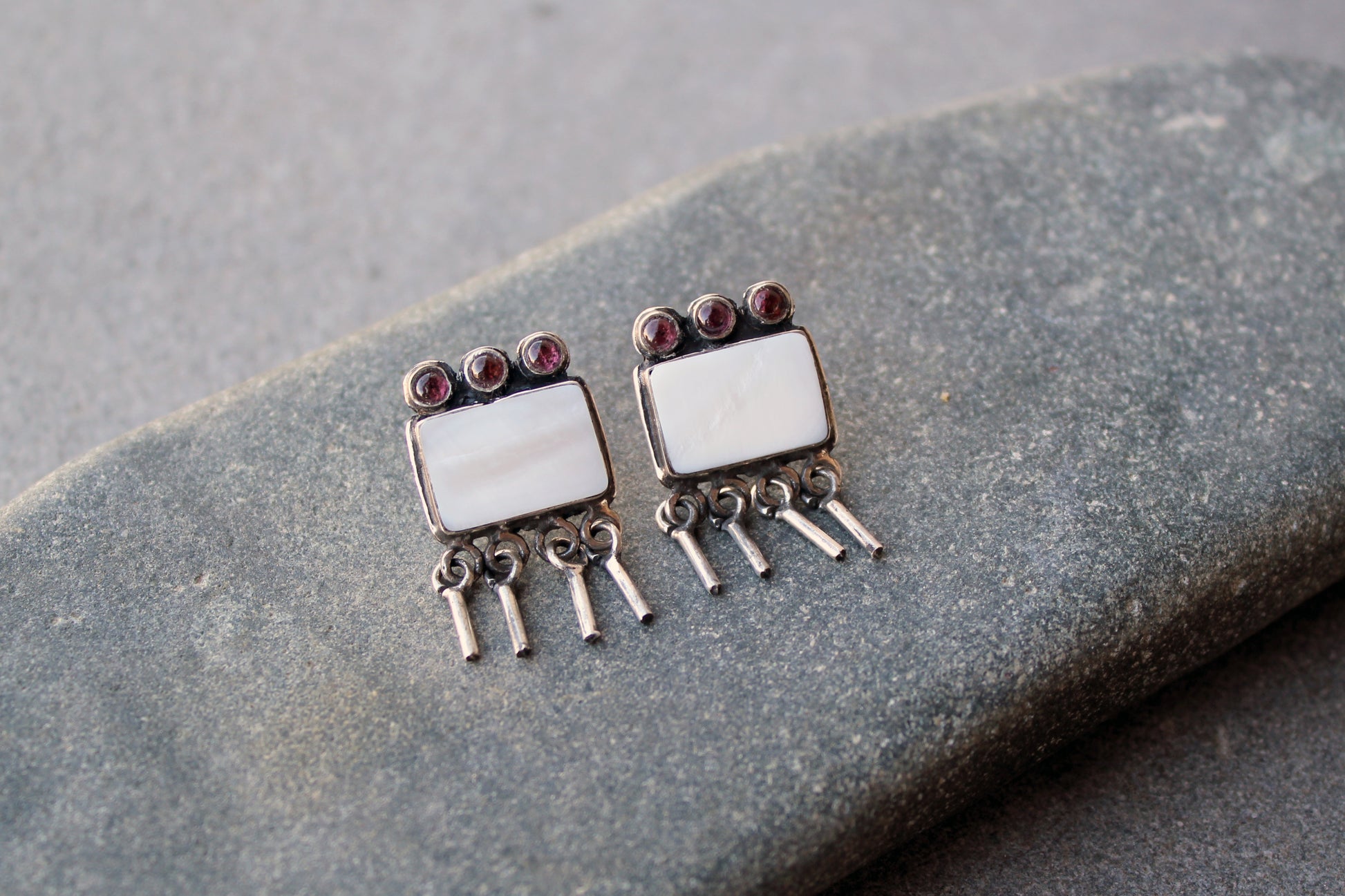 Armenian artisan handmade sterling silver stud earrings with square mother of pearl center, garnet stones and dangling fringe details