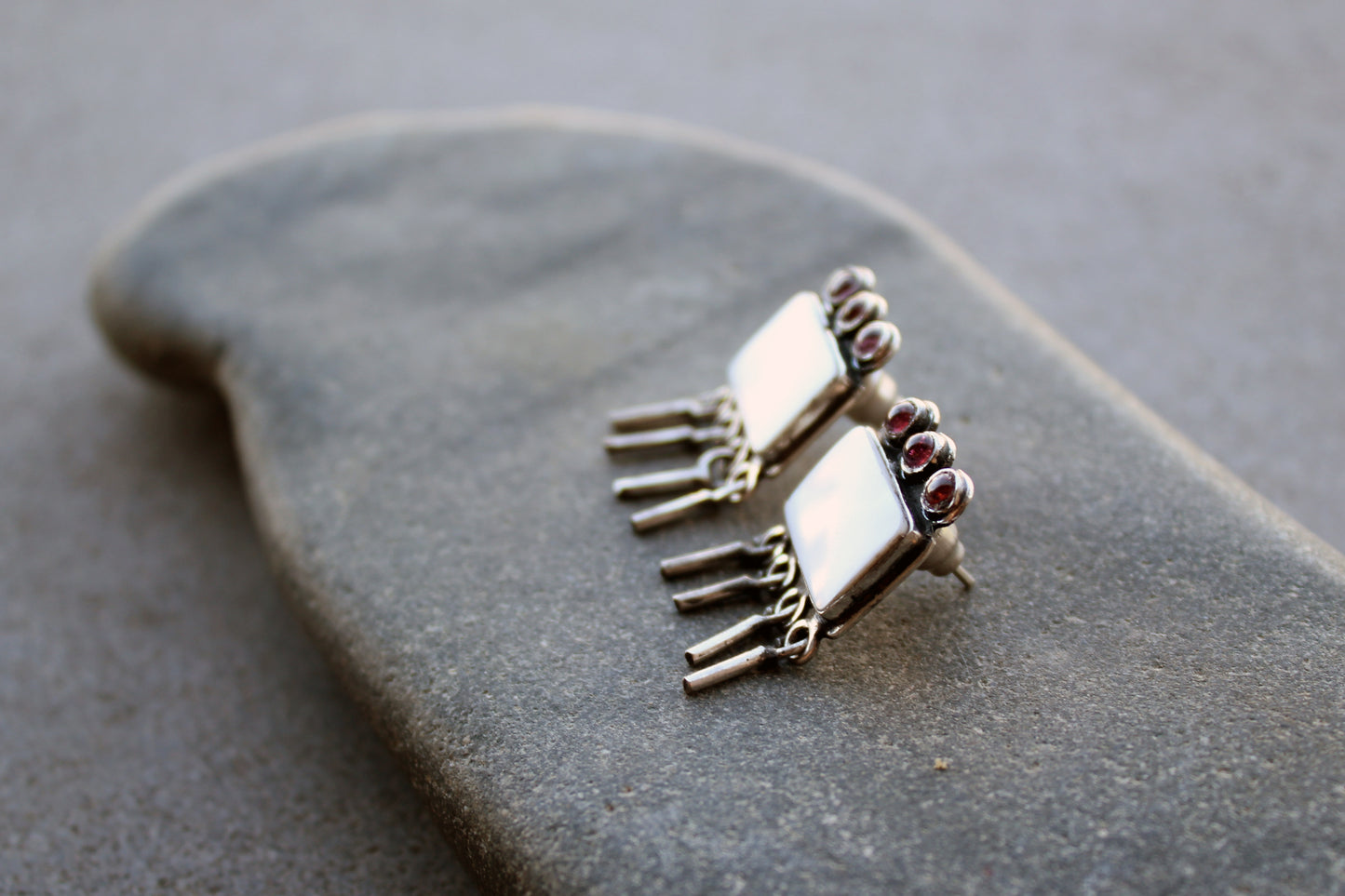 Armenian artisan handmade sterling silver stud earrings with square mother of pearl center, garnet stones and dangling fringe details