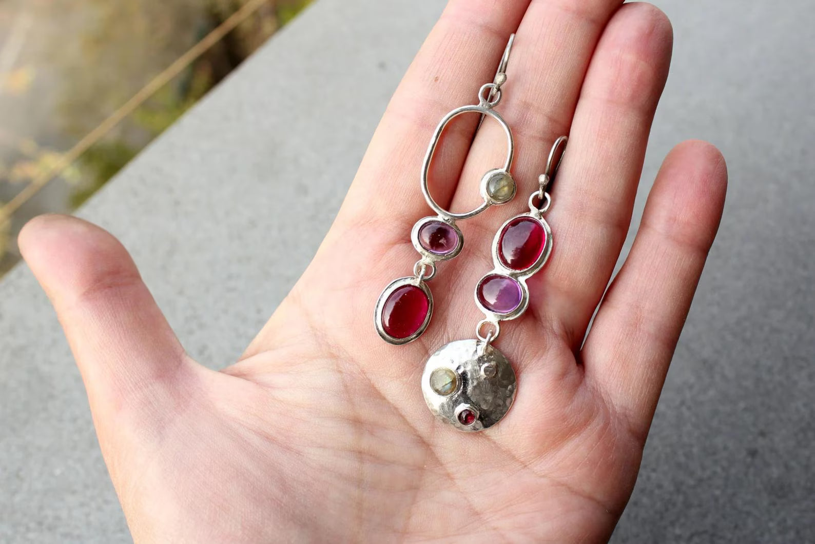 Mismatched sterling silver silversmith Armenian artisan handmade drop earrings, featuring oval red and purple corundums and labradorite stones